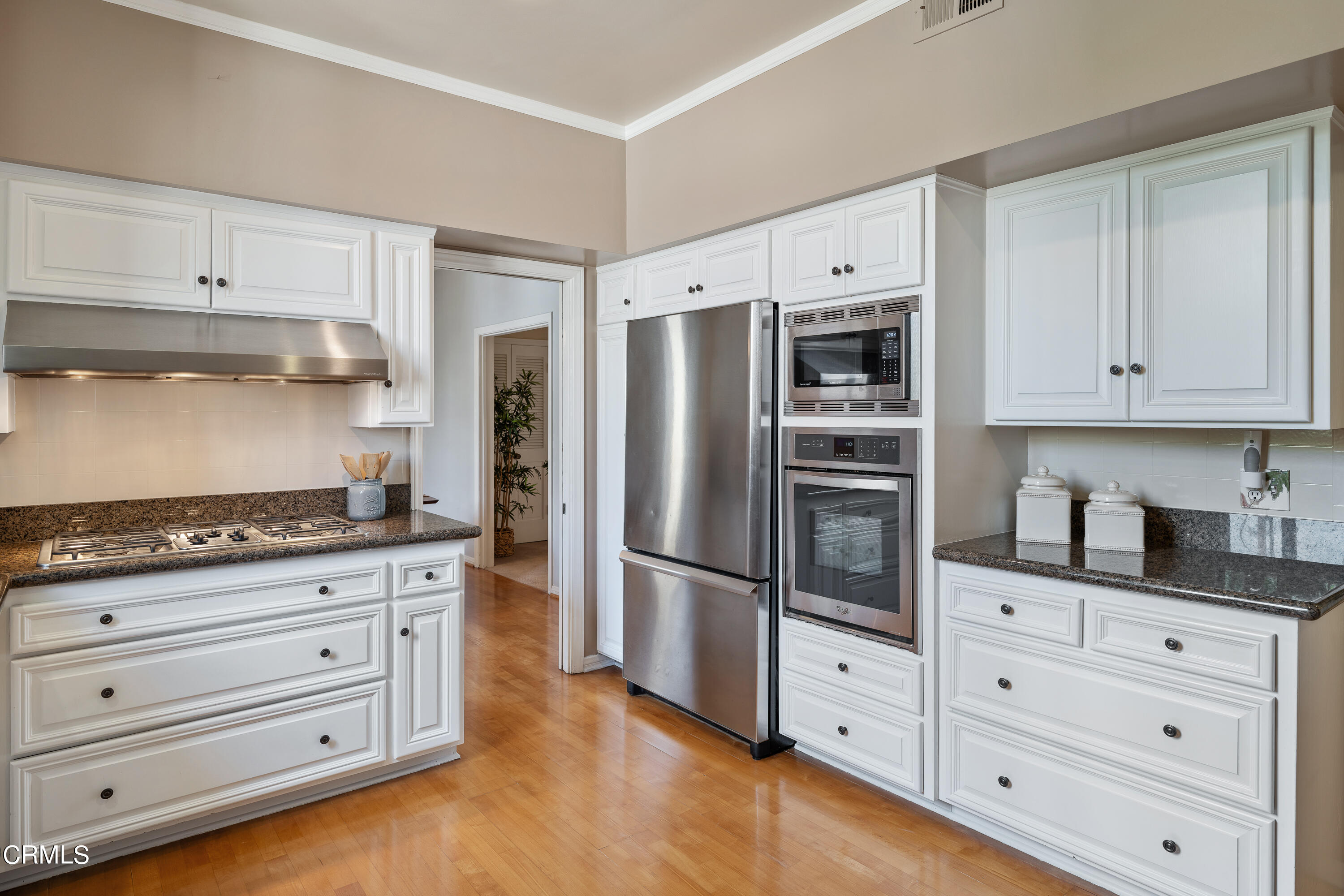 307 Arlington Drive Pasadena, CA 91105 - Photo 28 of 50 a kitchen with granite countertop cabinets and stainless steel appliances