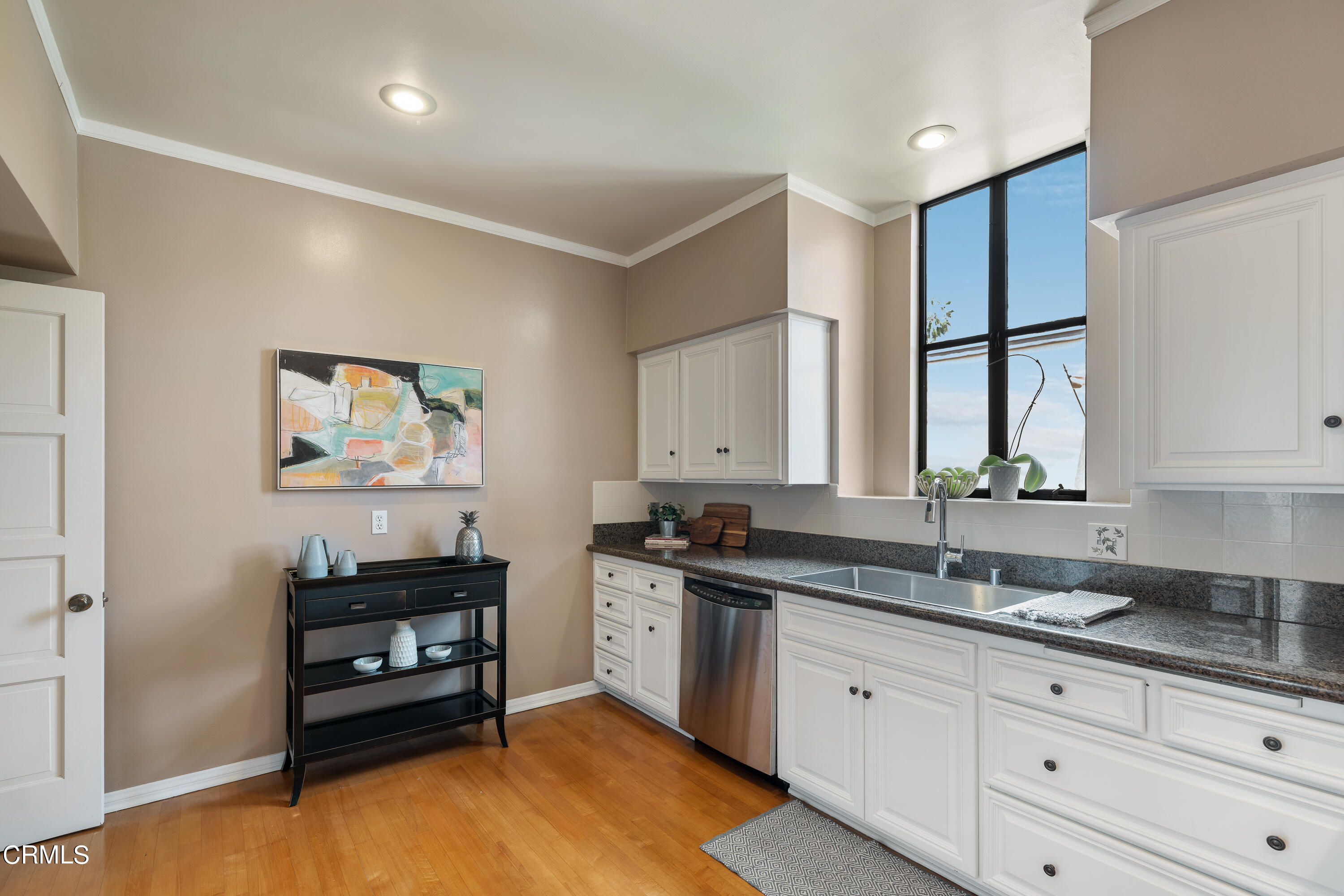 307 Arlington Drive Pasadena, CA 91105 - Photo 29 of 50 a kitchen with granite countertop a stove a sink and a window