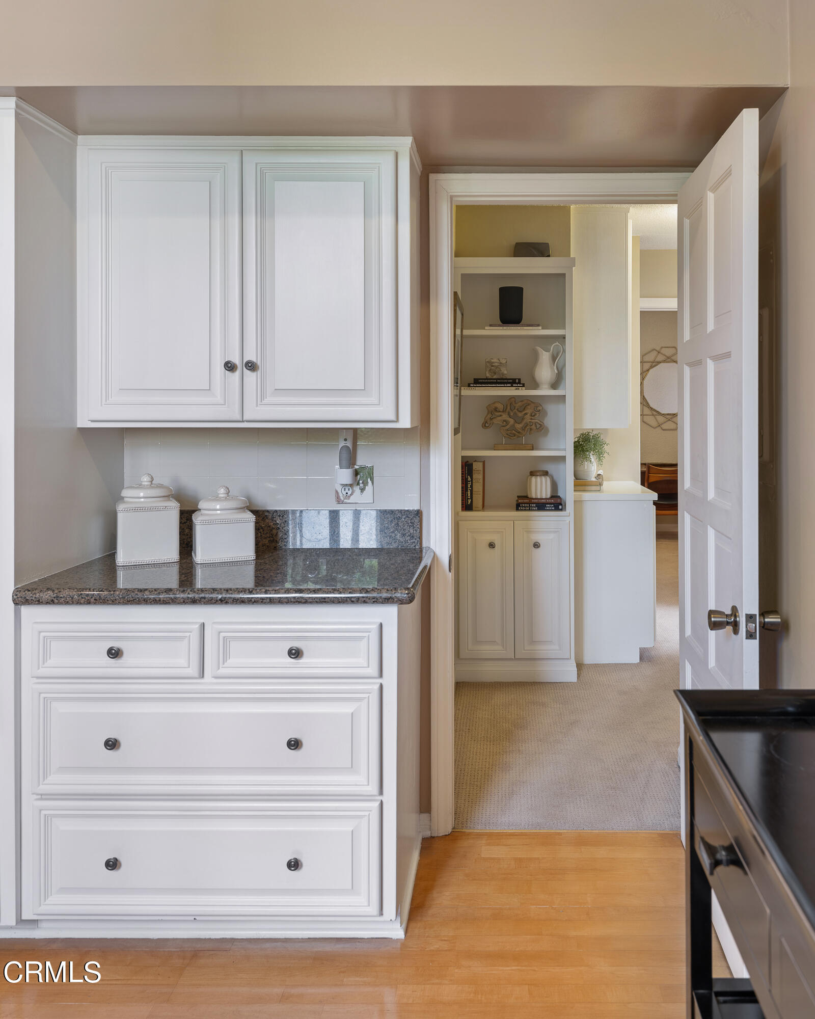 307 Arlington Drive Pasadena, CA 91105 - Photo 30 of 50 a kitchen with granite countertop white cabinets and stainless steel appliances