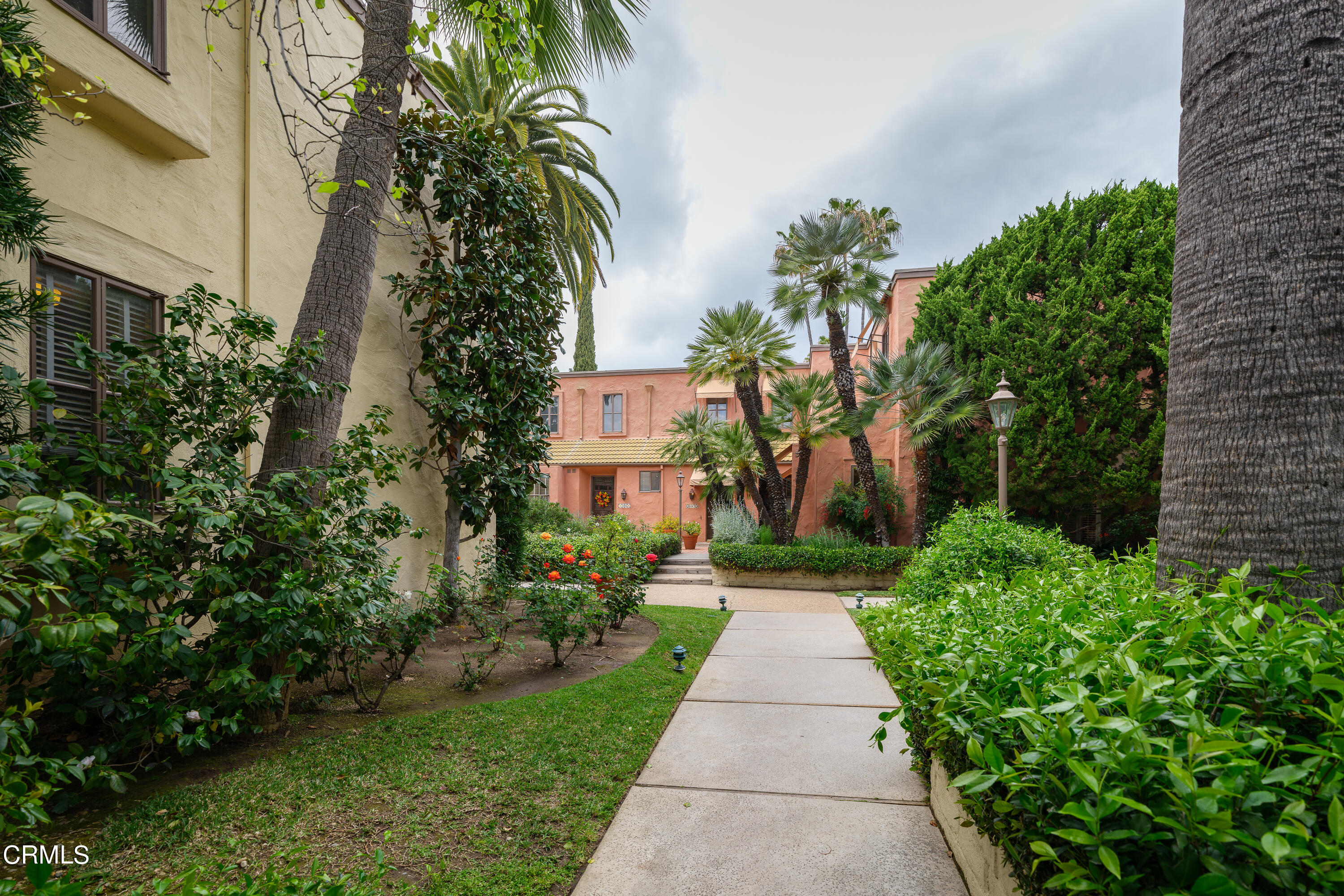307 Arlington Drive Pasadena, CA 91105 - Photo 3 of 50 a view of a pathway with house on both side