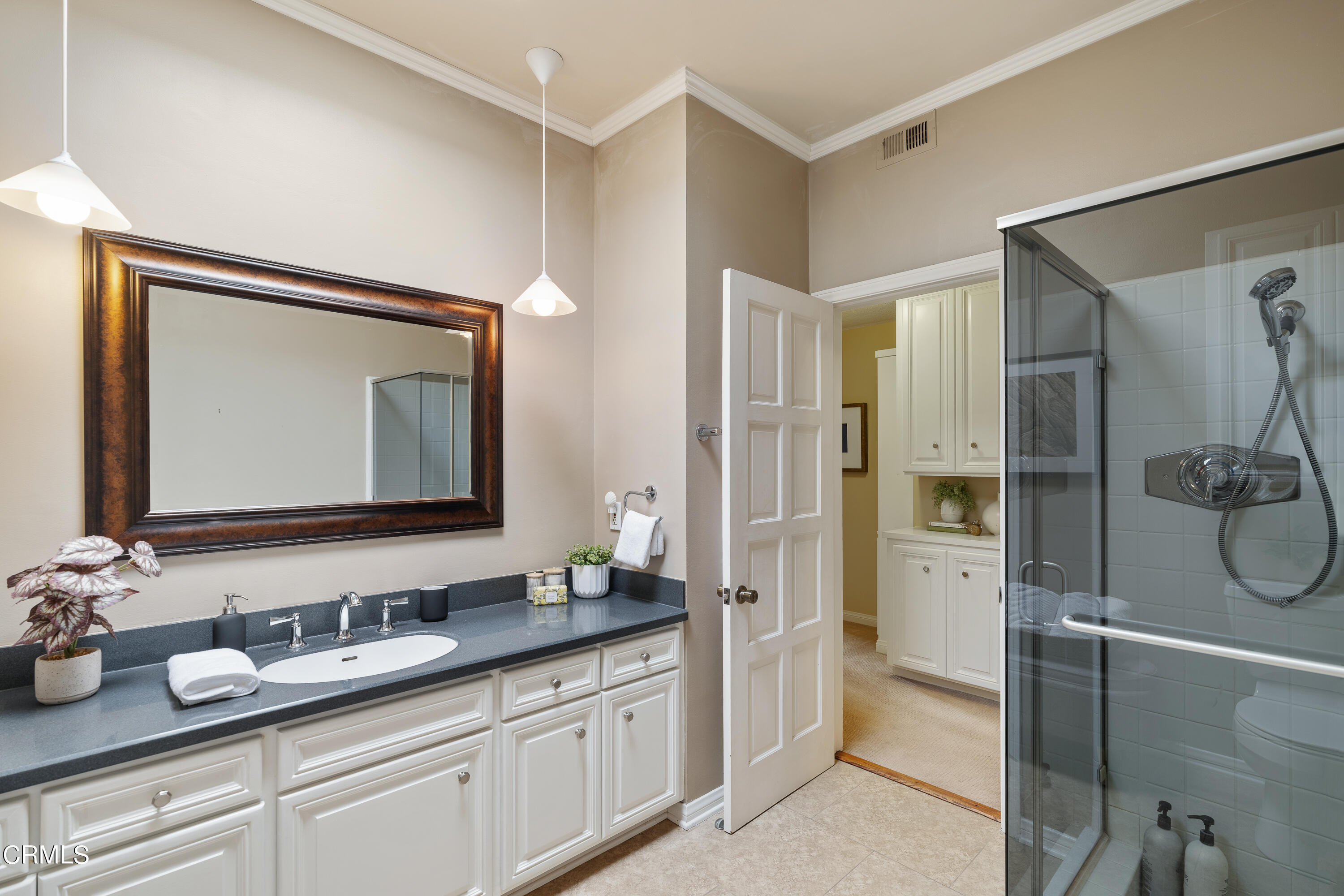 307 Arlington Drive Pasadena, CA 91105 - Photo 34 of 50 a bathroom with a double vanity sink mirror and shower