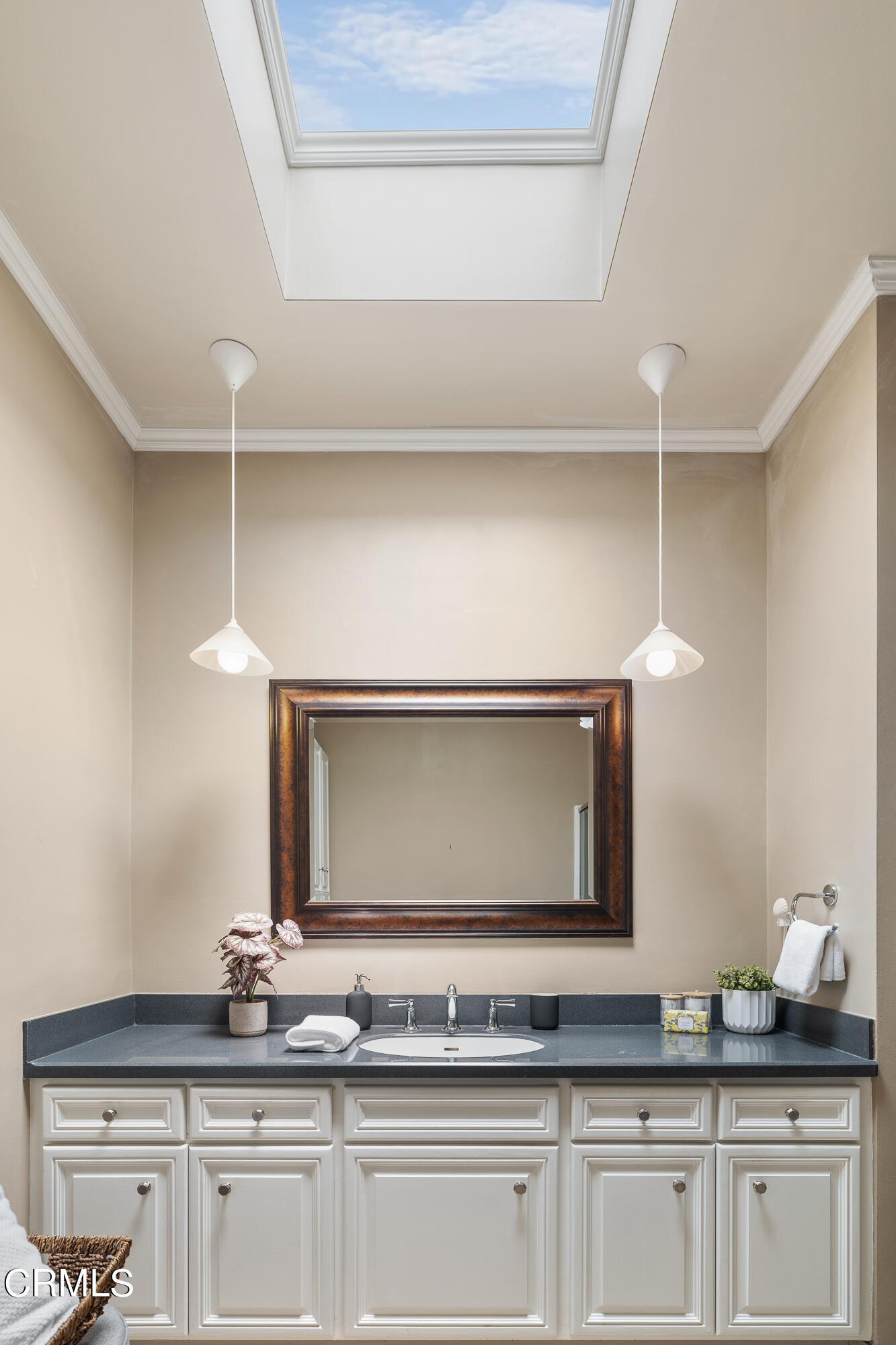307 Arlington Drive Pasadena, CA 91105 - Photo 35 of 50 a bathroom with a granite countertop sink and a mirror