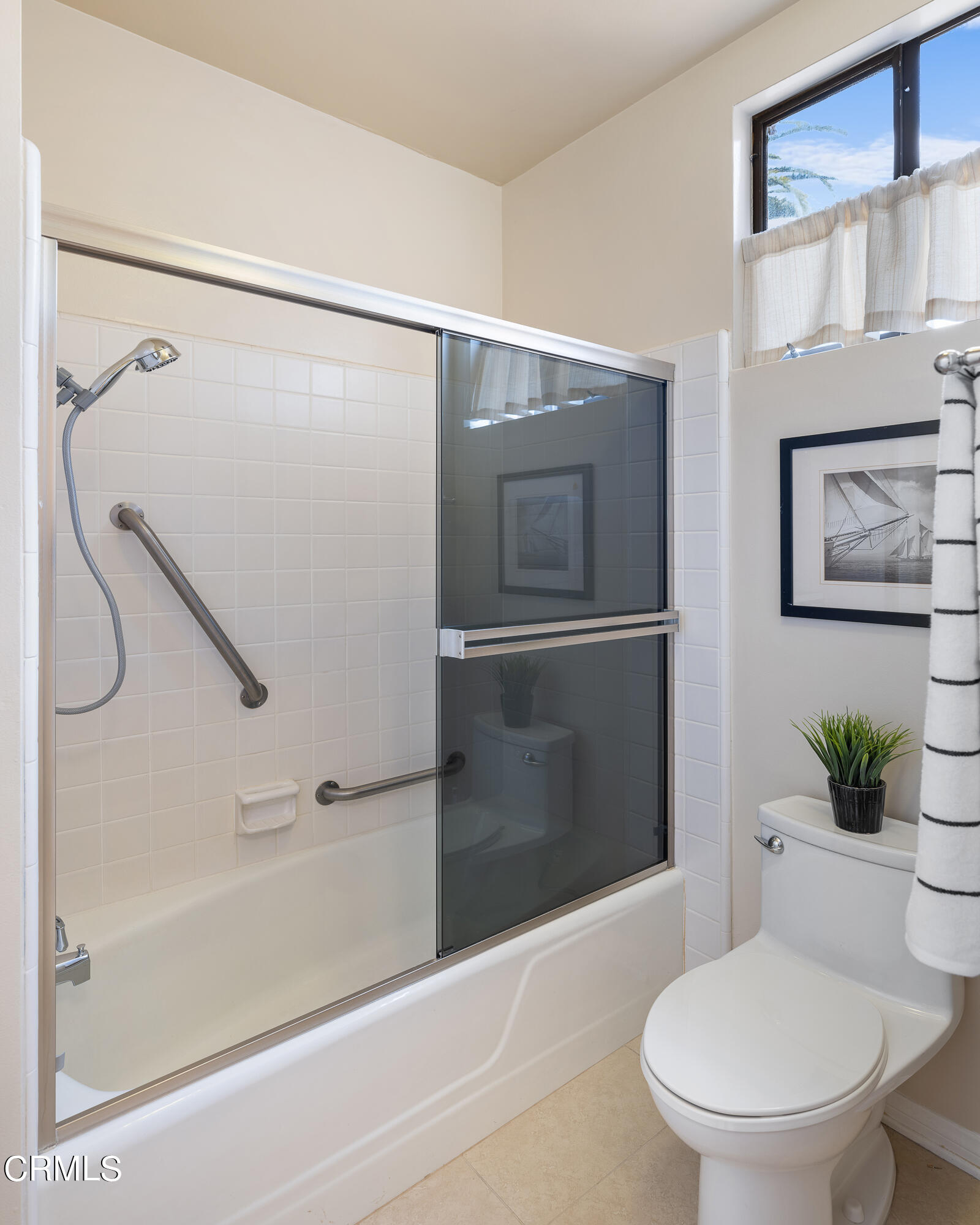 307 Arlington Drive Pasadena, CA 91105 - Photo 37 of 50 a white toilet sitting next to a bath tub