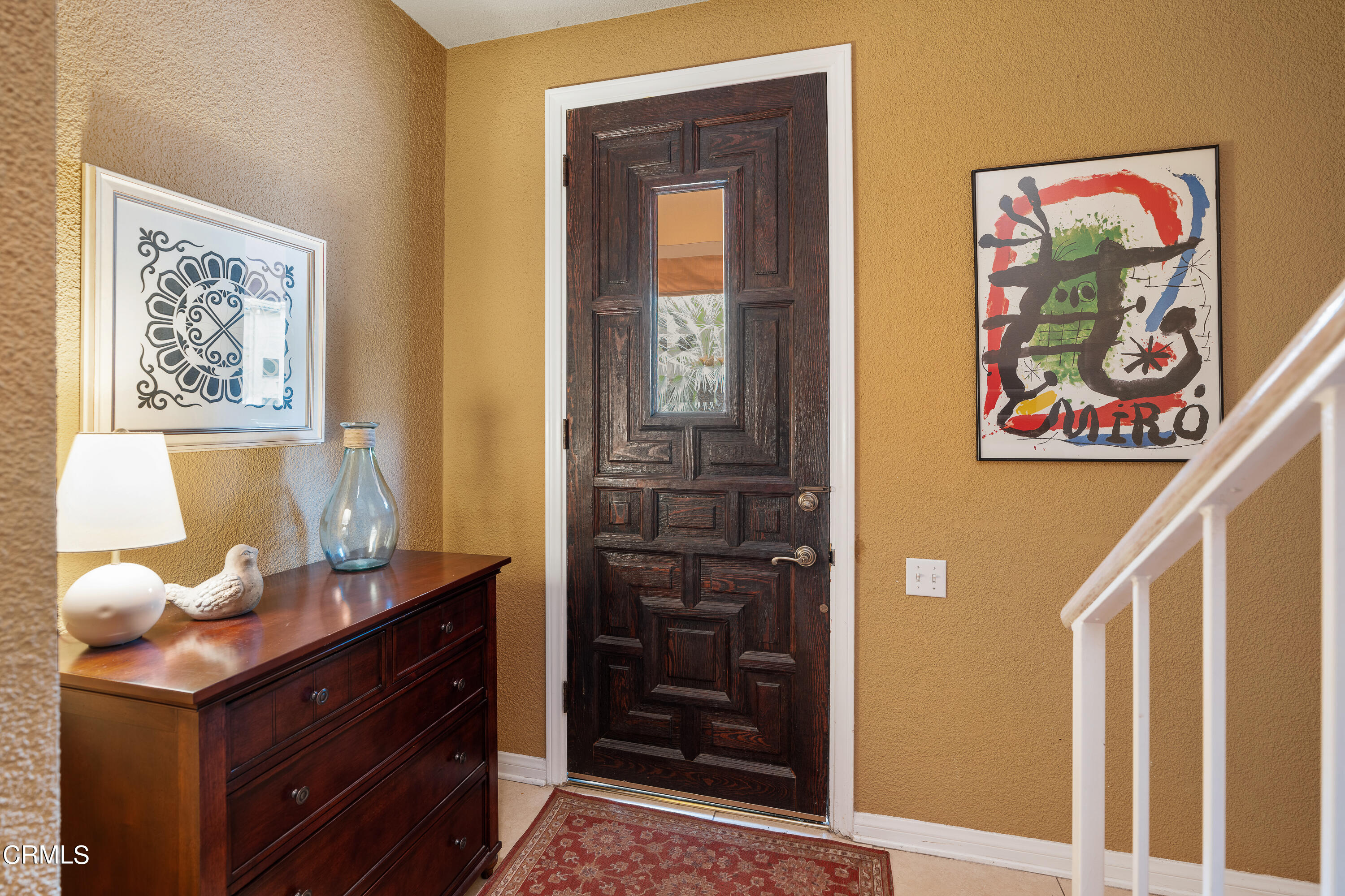 307 Arlington Drive Pasadena, CA 91105 - Photo 7 of 50 a room with painting on the wall and a potted plant