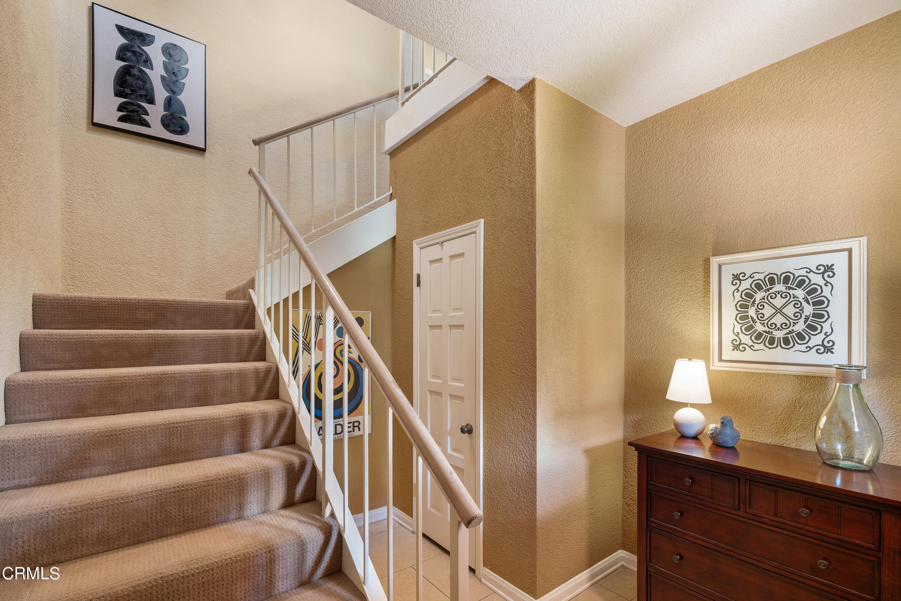 307 Arlington Drive Pasadena, CA 91105 - Photo 8 of 50 a view of staircase with wooden floor and furniture