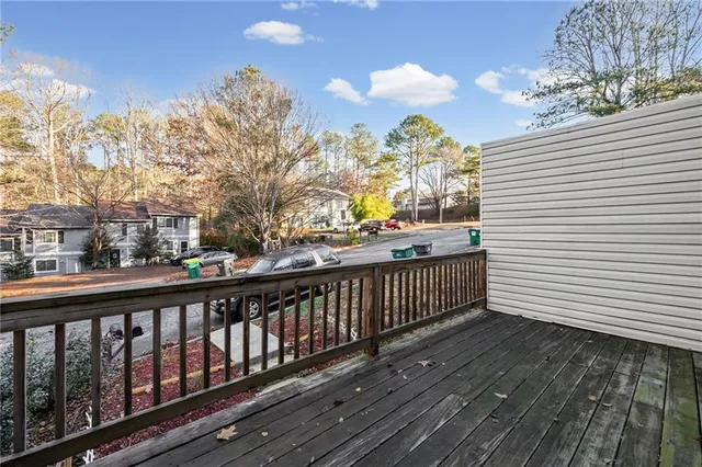 a view of a balcony with wooden floor