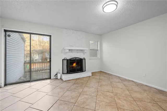 an empty room with fireplace