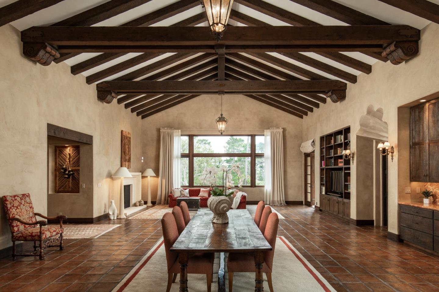 a dining room with furniture and wooden floor
