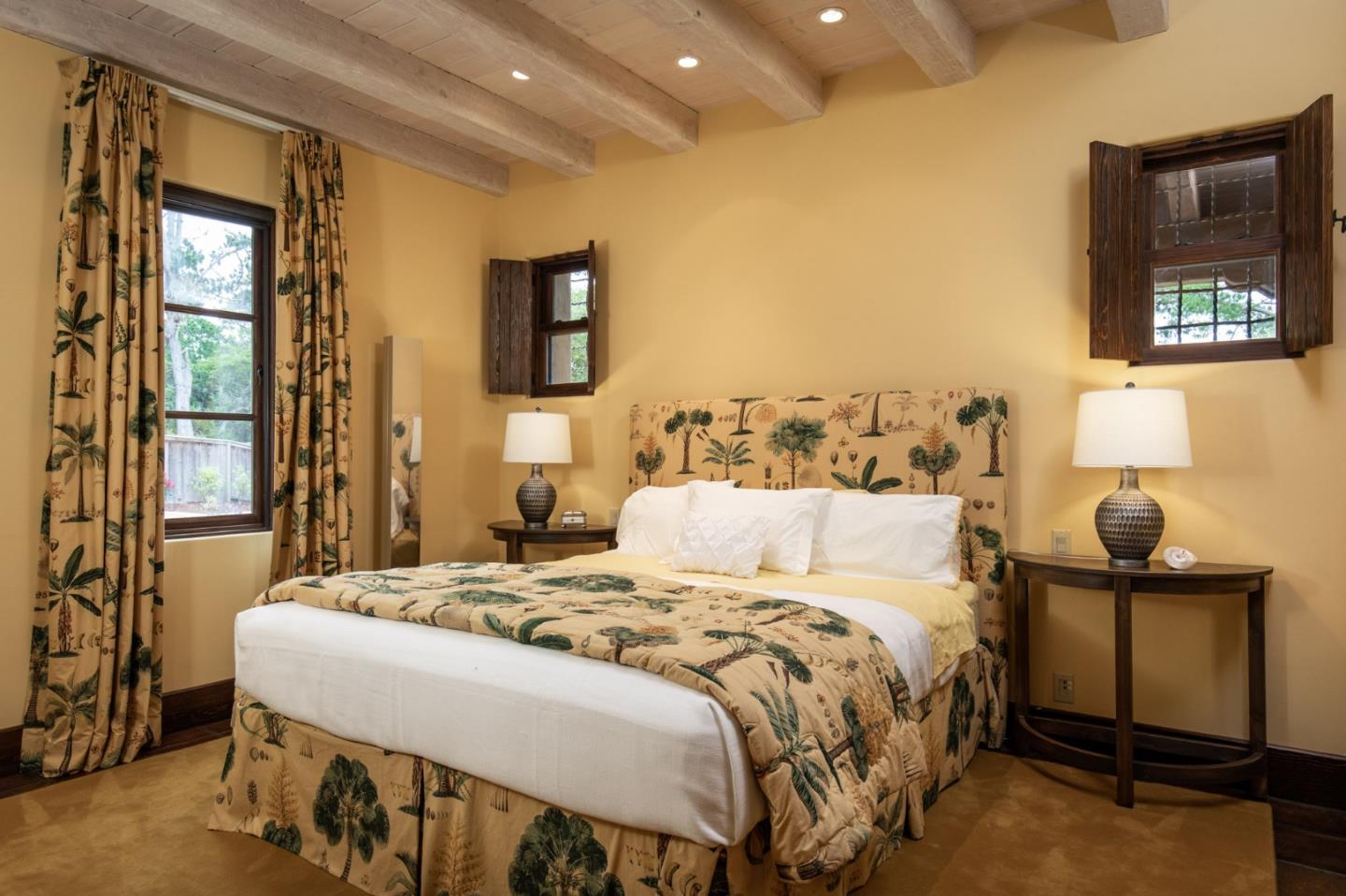 1425 Oleada Road Pebble Beach, CA 93953 - Photo 14 of 26 a bedroom with a bed and large windows