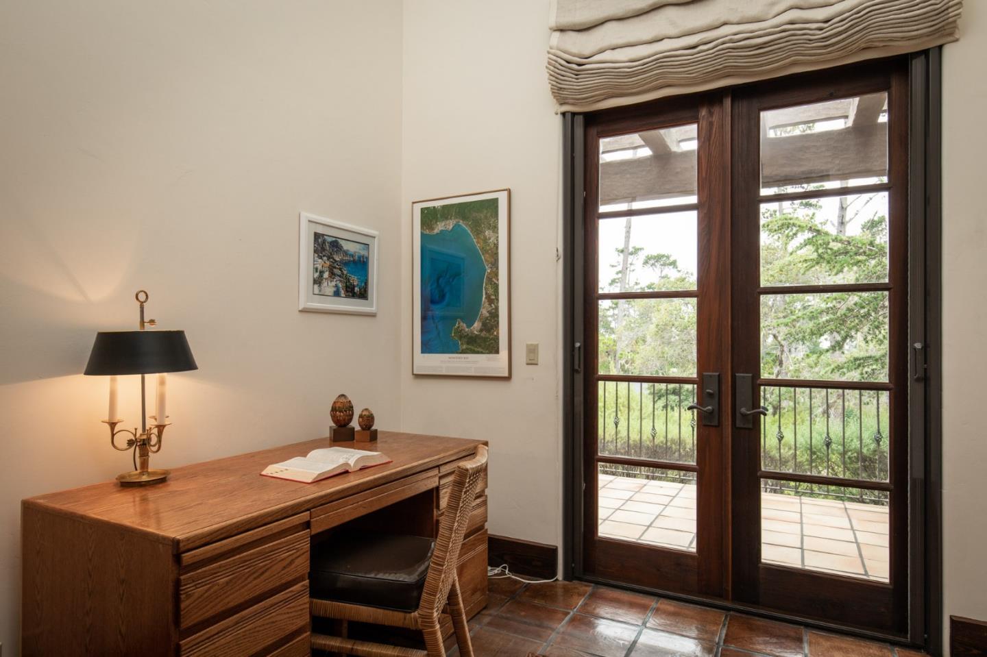 1425 Oleada Road Pebble Beach, CA 93953 - Photo 15 of 26 a table and chairs in a room next to a window