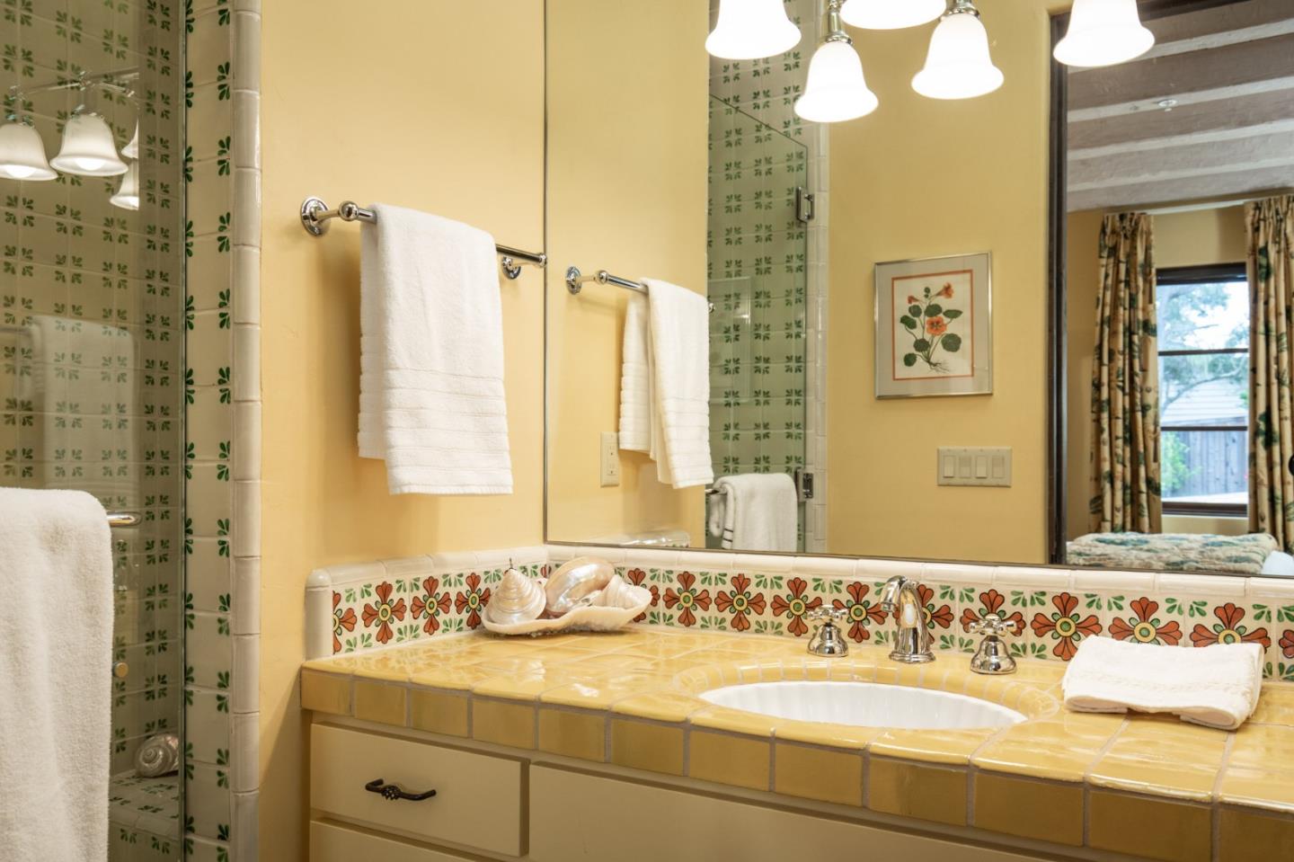 1425 Oleada Road Pebble Beach, CA 93953 - Photo 16 of 26 a bathroom with a sink and a mirror