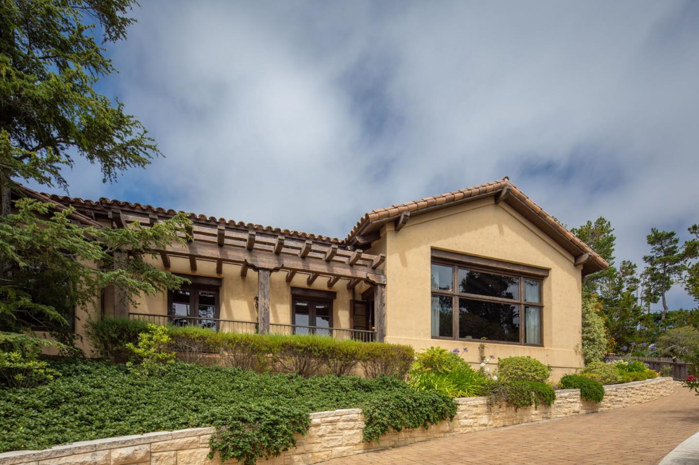 1425 Oleada Road Pebble Beach, CA 93953 - Photo 18 of 26 front view of a house with a yard