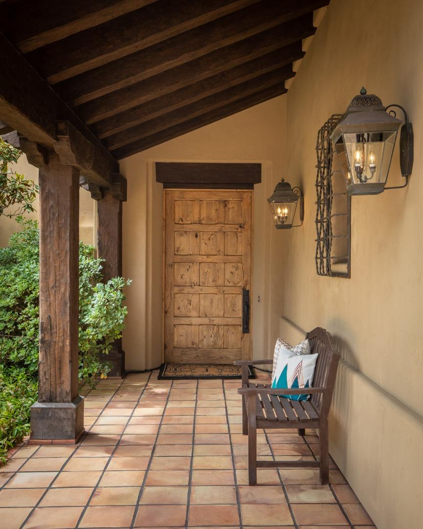1425 Oleada Road Pebble Beach, CA 93953 - Photo 21 of 26 a view of a porch with furniture and front door