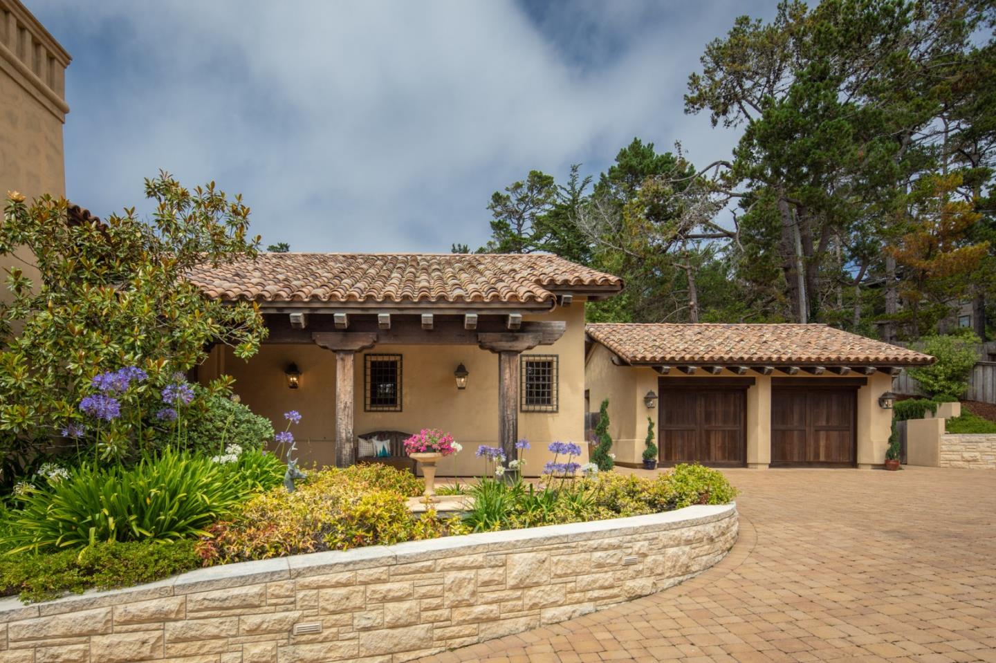 1425 Oleada Road Pebble Beach, CA 93953 - Photo 22 of 26 a front view of a house with garden