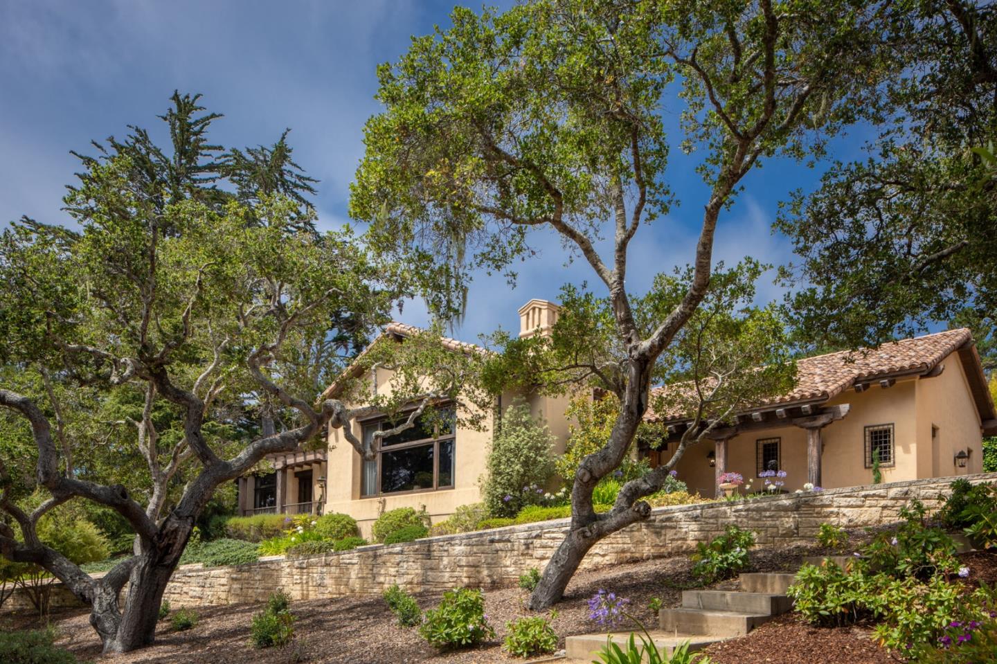1425 Oleada Road Pebble Beach, CA 93953 - Photo 23 of 26 front view of a house with a tree