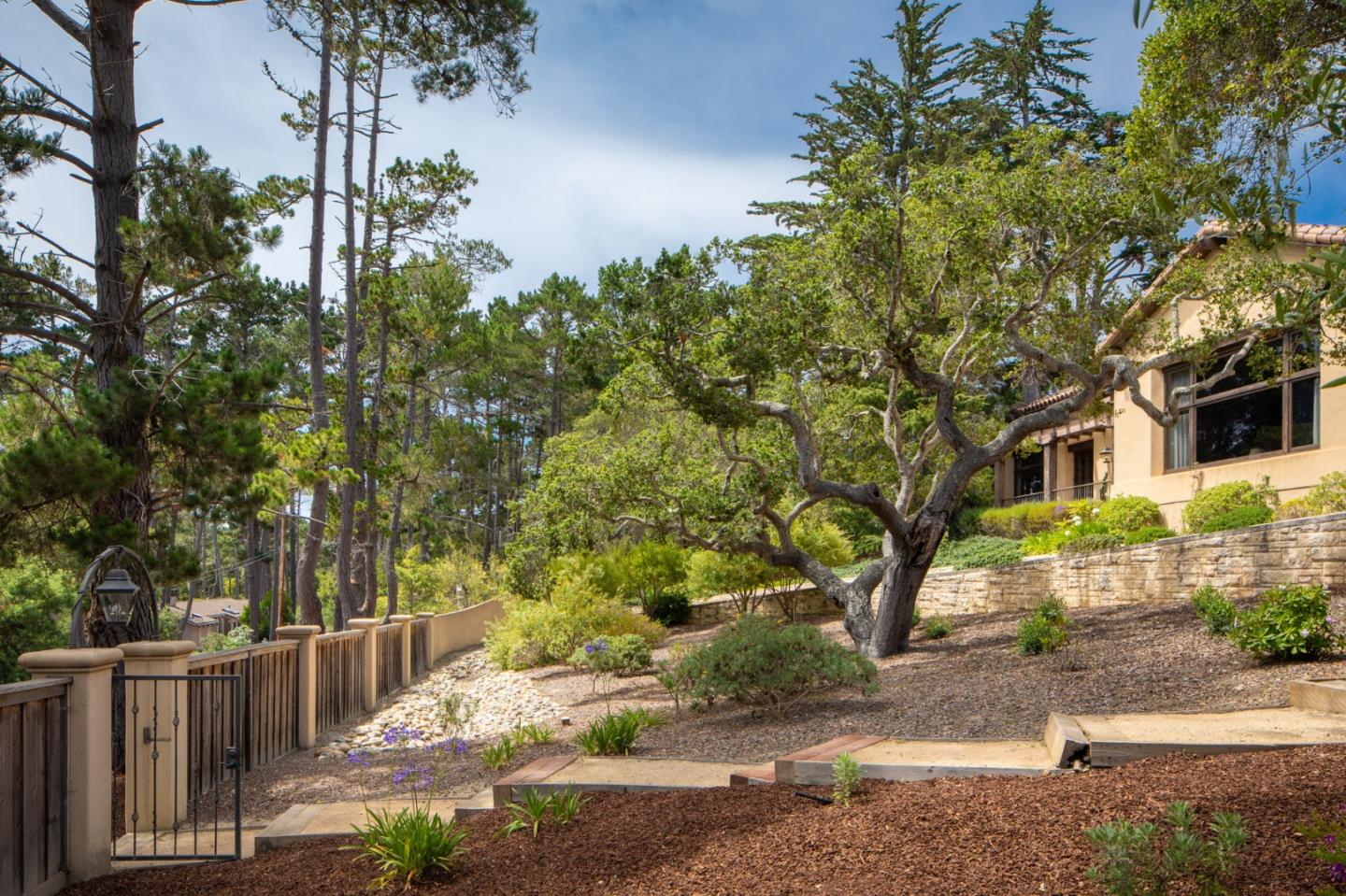 1425 Oleada Road Pebble Beach, CA 93953 - Photo 24 of 26 front view of a house with a tree
