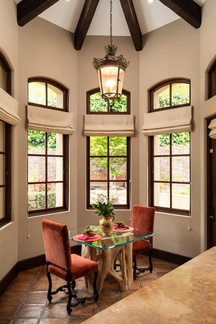 1425 Oleada Road Pebble Beach, CA 93953 - Photo 5 of 26 a dining room with wooden floor and a window