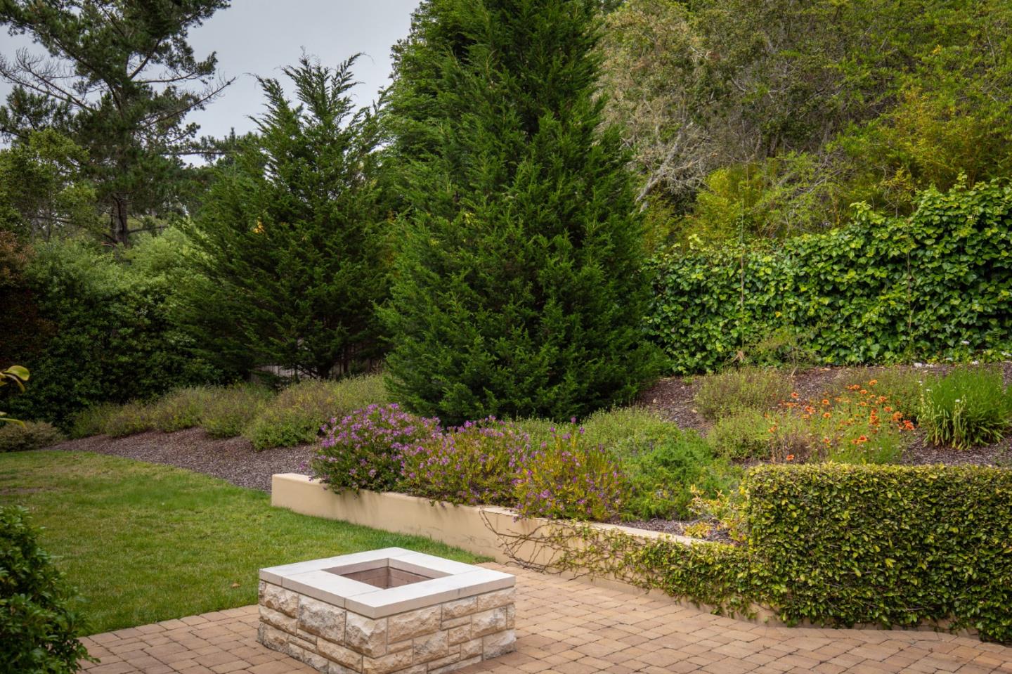 1425 Oleada Road Pebble Beach, CA 93953 - Photo 8 of 26 an aerial view of a house with a yard