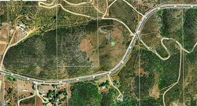 view of a wooden floor with a bench