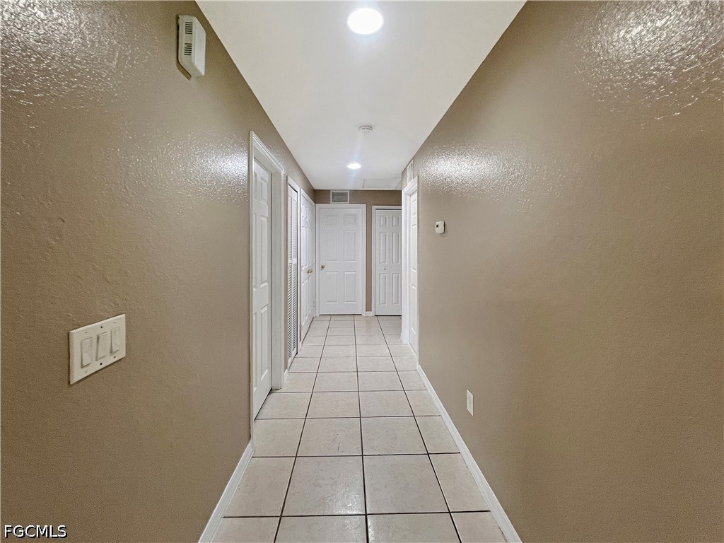5231 27th Street Southwest Lehigh Acres, FL 33973 - Photo 10 of 22 a view of a hallway