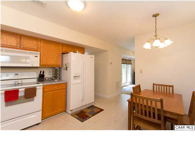 1 Begum Road Palmyra, VA 22963 - Photo 8 of 26 a kitchen with stainless steel appliances kitchen island granite countertop a refrigerator a stove and a sink with granite countertops