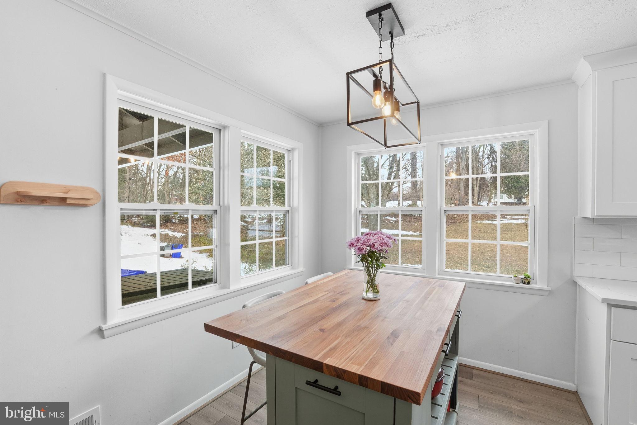 2207 Victor Court Silver Spring, MD 20906 - Photo 15 of 40 a view of a dining room with furniture window and wooden floor