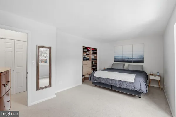 a bed room with a bed and a window