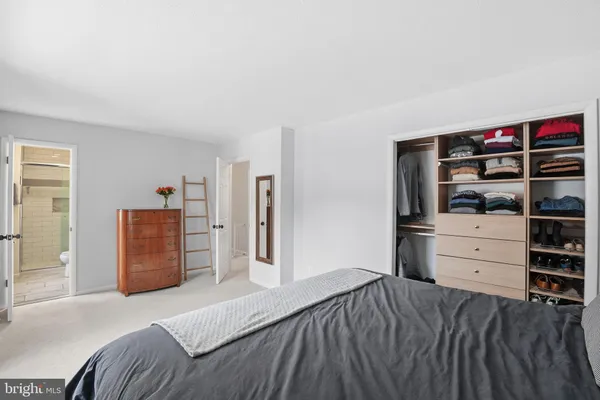 a bedroom with a bed and furniture