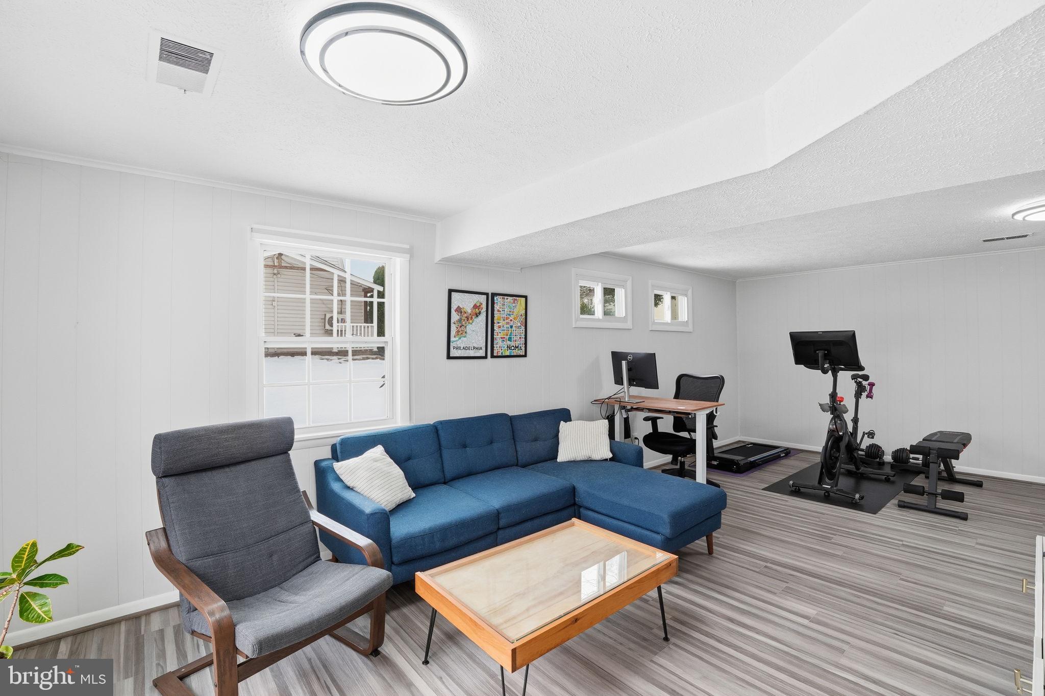 2207 Victor Court Silver Spring, MD 20906 - Photo 29 of 40 a living room with furniture and a wooden floor