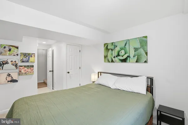 a bedroom with a bed and closet