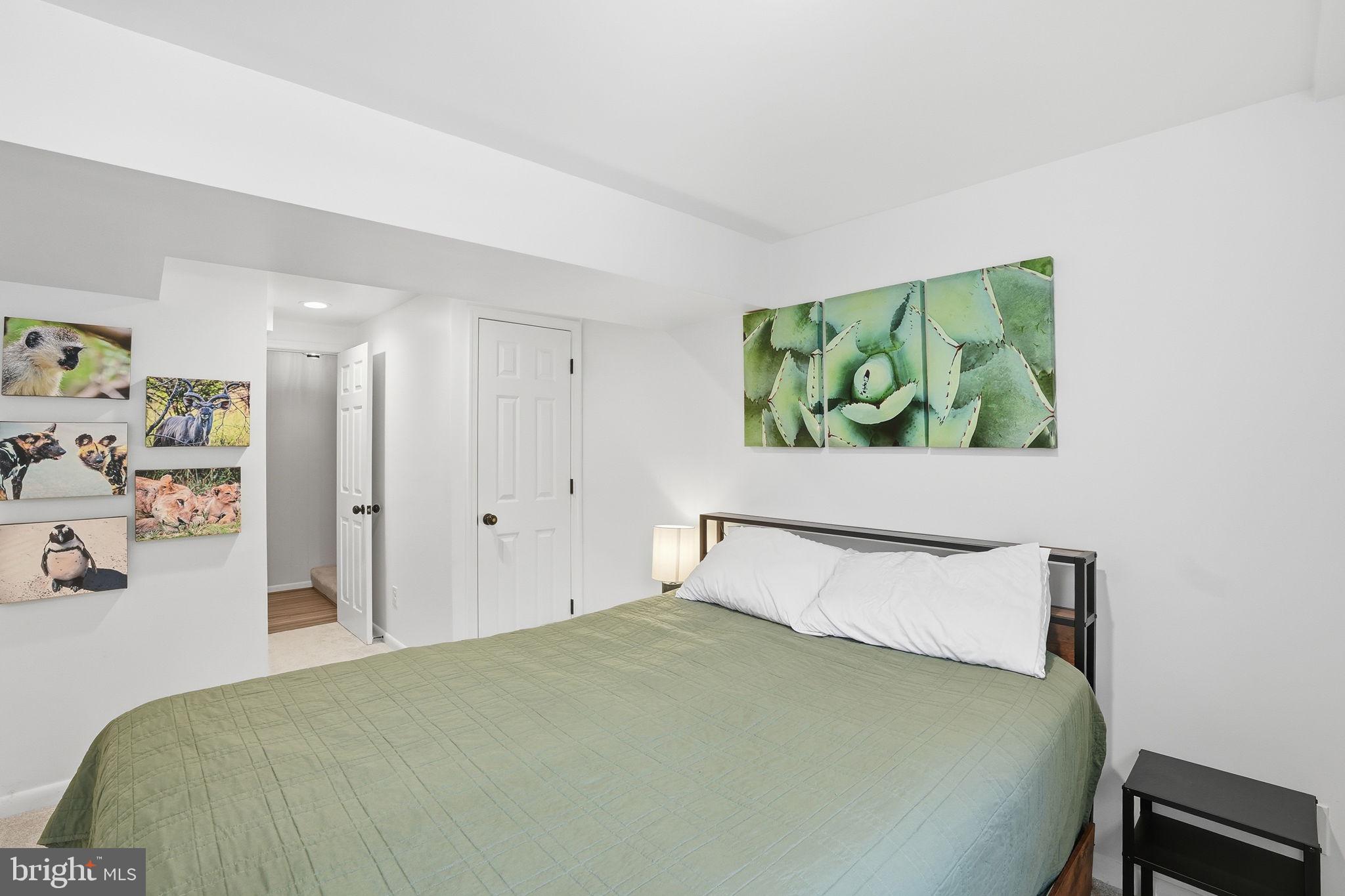 2207 Victor Court Silver Spring, MD 20906 - Photo 31 of 40 a bedroom with a bed and a window