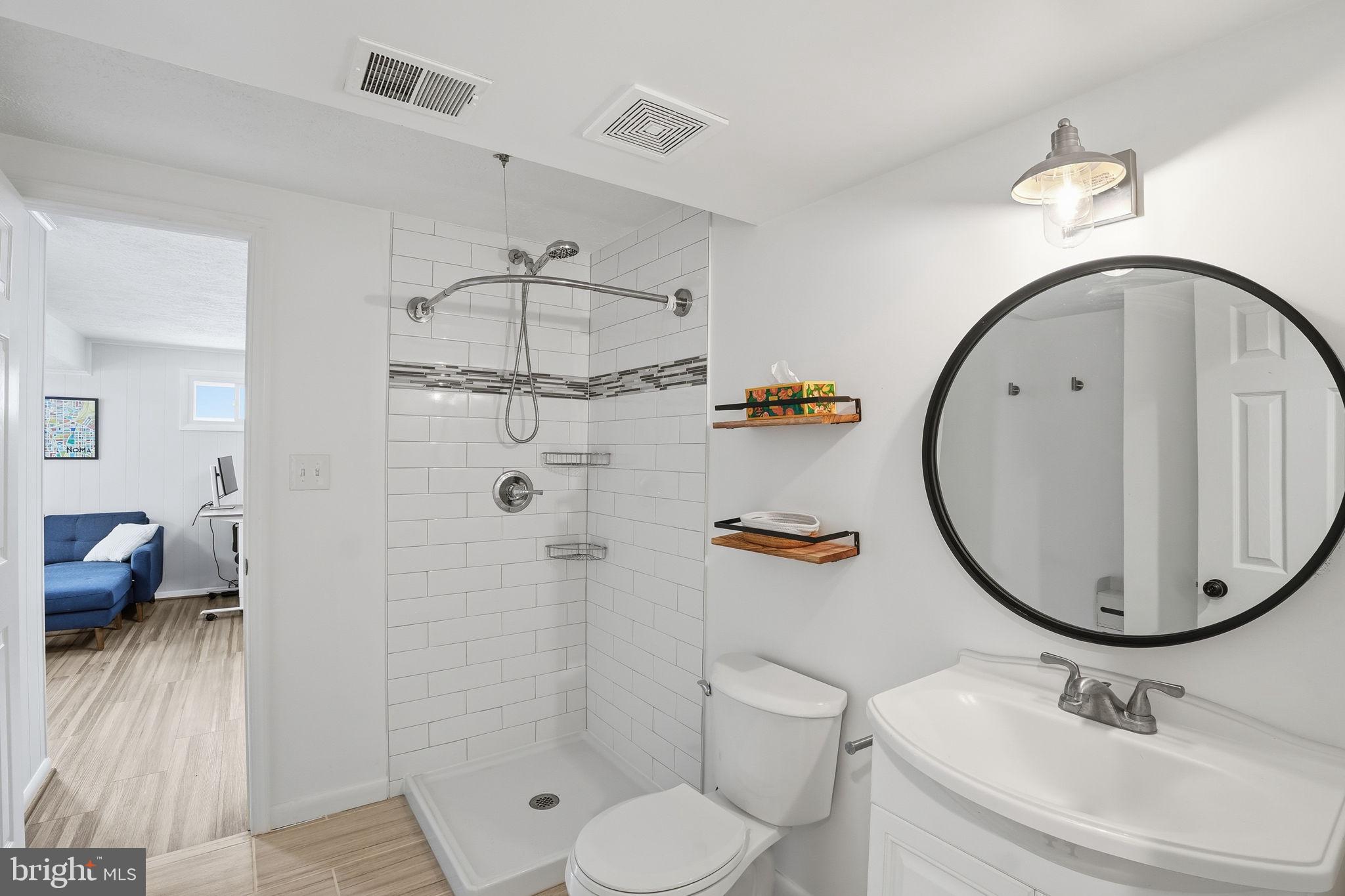 2207 Victor Court Silver Spring, MD 20906 - Photo 33 of 40 a bathroom with a sink toilet and shower