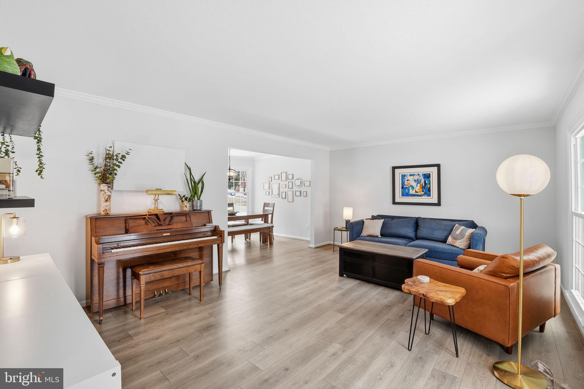 2207 Victor Court Silver Spring, MD 20906 - Photo 4 of 40 a living room with furniture and a wooden floor