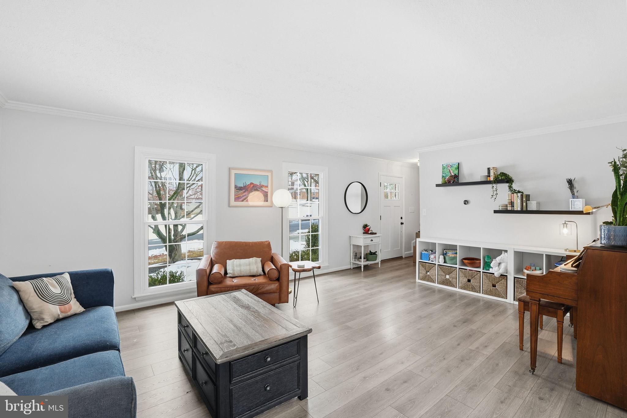 2207 Victor Court Silver Spring, MD 20906 - Photo 6 of 40 a living room with furniture and a wooden floor