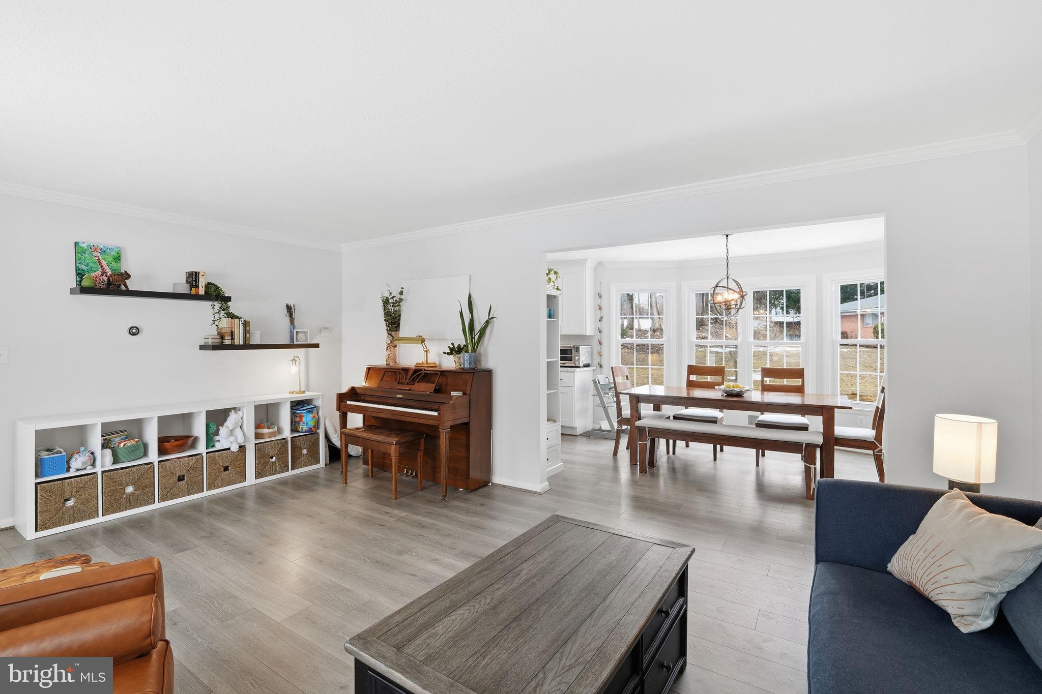 2207 Victor Court Silver Spring, MD 20906 - Photo 7 of 40 a living room with furniture and a table