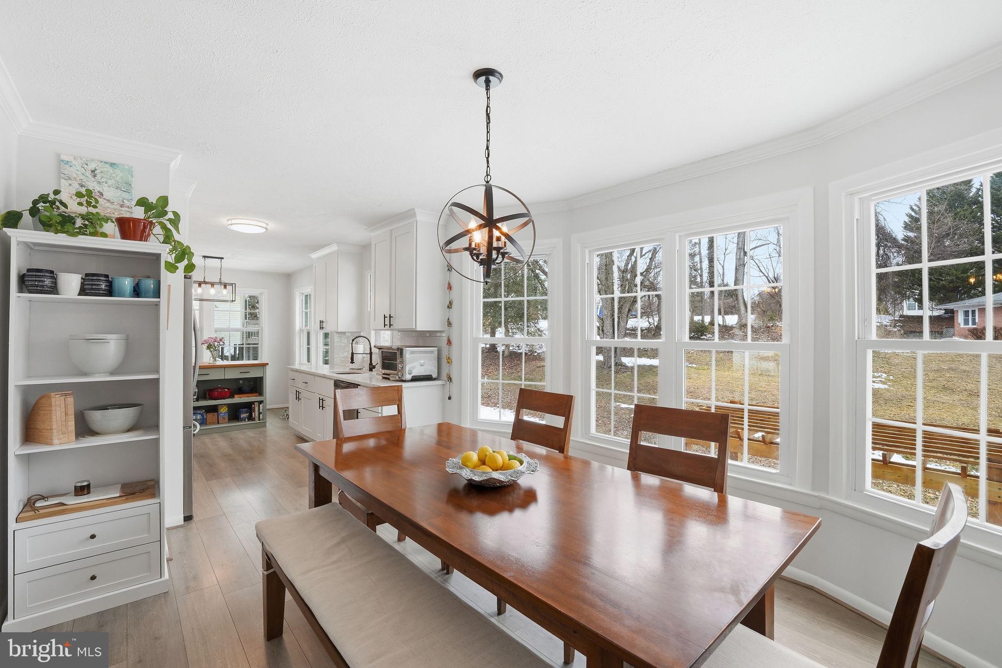 2207 Victor Court Silver Spring, MD 20906 - Photo 10 of 40 a living room with furniture a rug and a chandelier