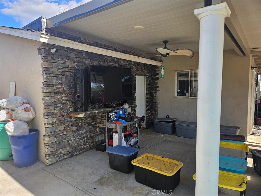 19263 Easton Street Rialto, CA 92376 - Photo 9 of 16 a living room with furniture and a flat screen tv