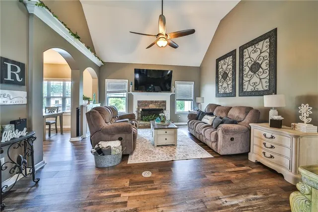 a living room with furniture fireplace and a flat screen tv