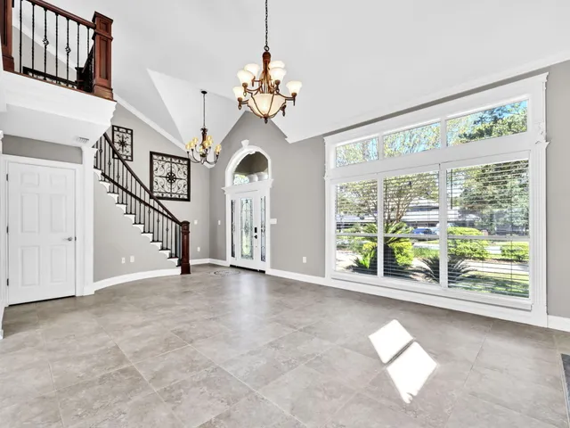 a kitchen with stainless steel appliances granite countertop a stove and a refrigerator