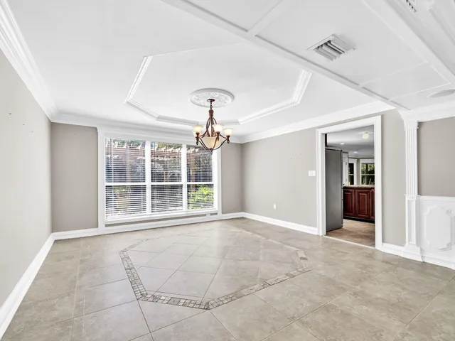a stove top oven sitting inside of a kitchen