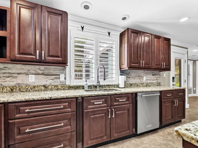 a view of a livingroom with a ceiling fan and window