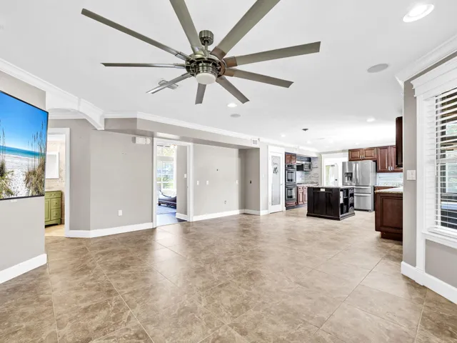 a view of a house with backyard sitting area and swimming pool