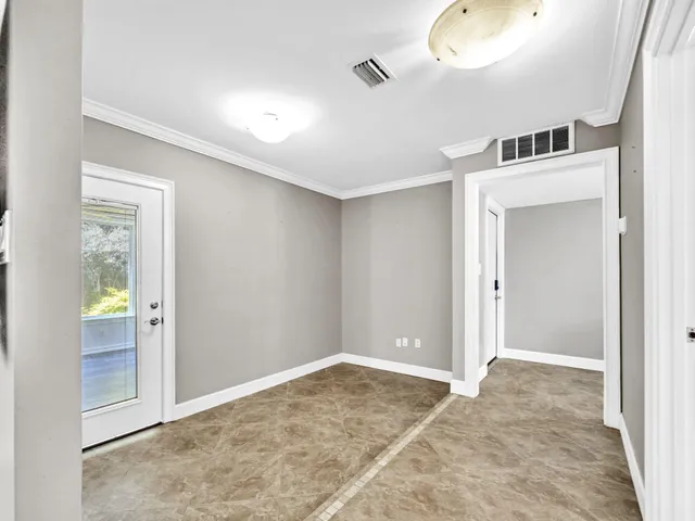 a view of room with hardwood floor and window