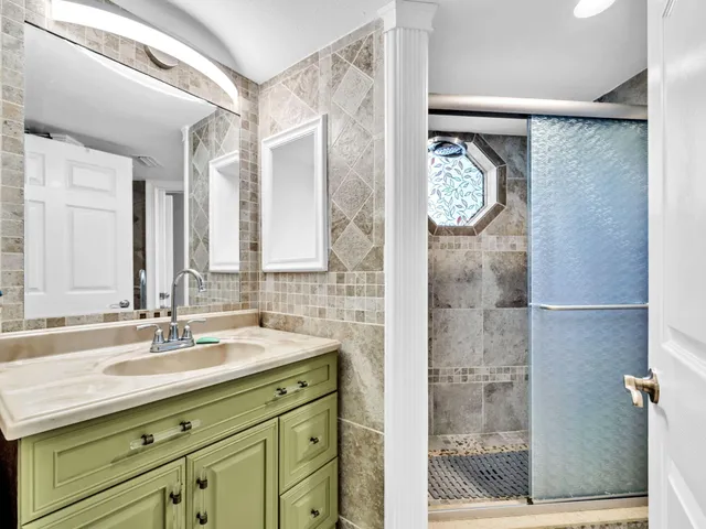 a view of a chair and tables in the balcony