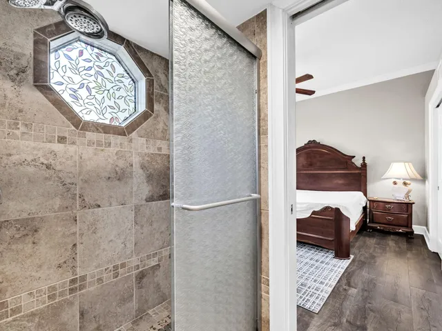 a view of a balcony with wooden fence