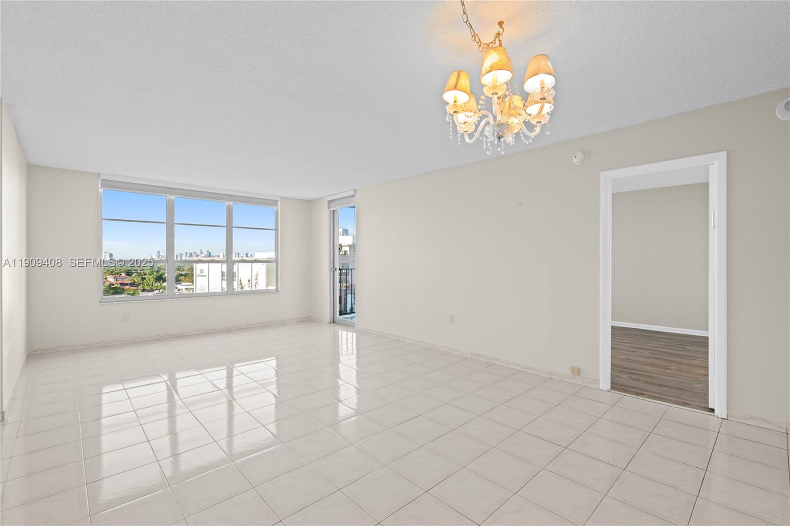 4101 Pine Tree Drive, Unit 802 Miami Beach, FL 33140 - Photo 13 of 58 an empty room with windows and entrance