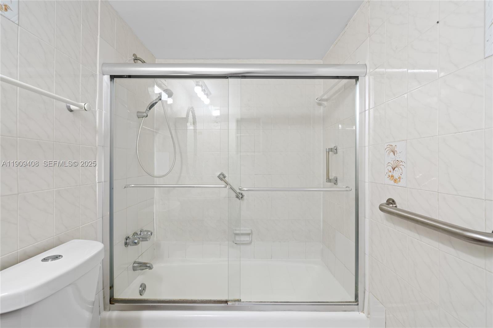 4101 Pine Tree Drive, Unit 802 Miami Beach, FL 33140 - Photo 19 of 58 a bathroom with a shower