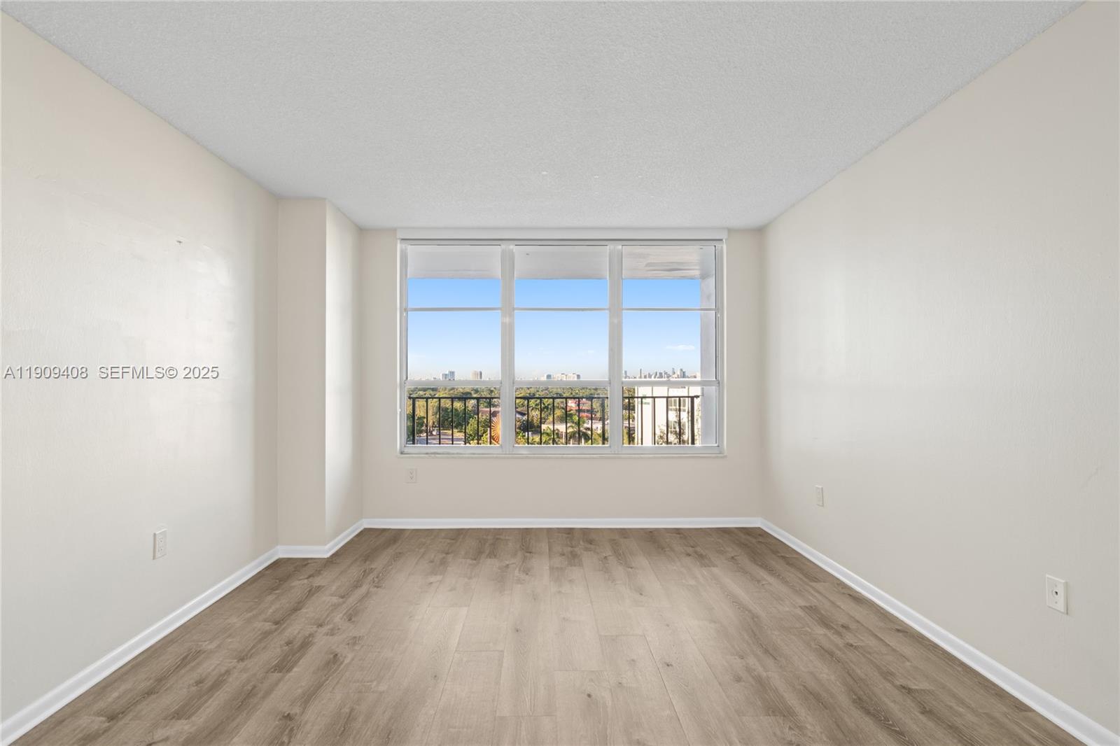 4101 Pine Tree Drive, Unit 802 Miami Beach, FL 33140 - Photo 22 of 58 an empty room with a window