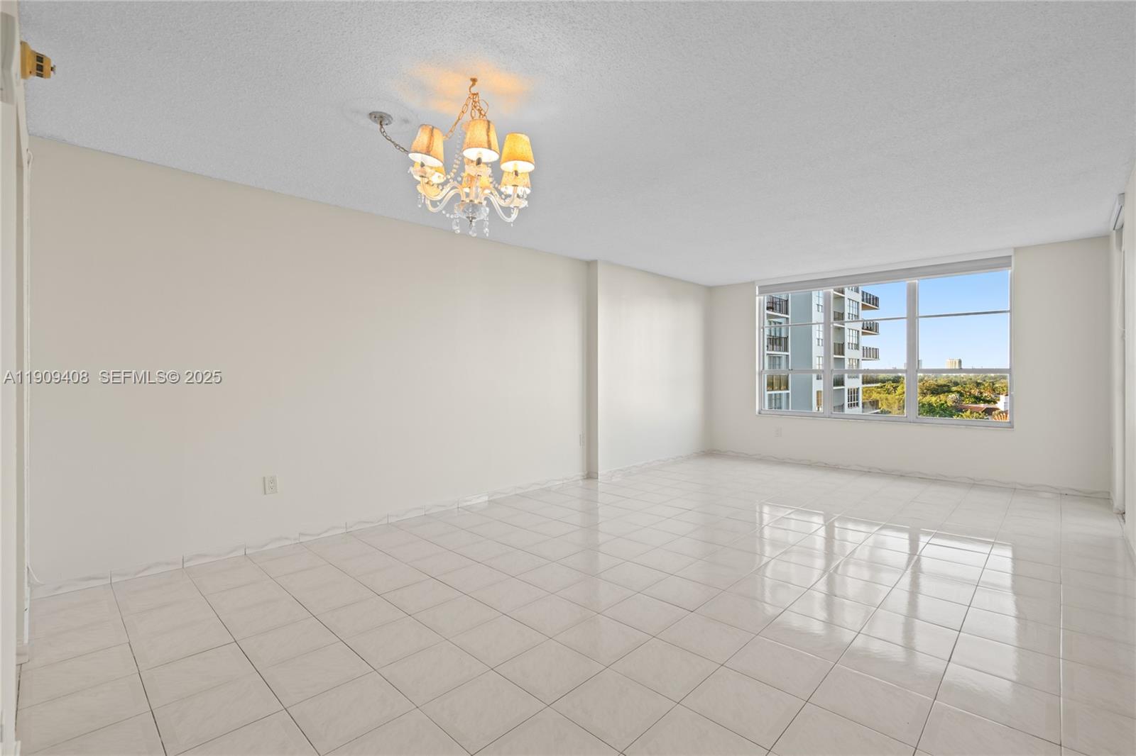 4101 Pine Tree Drive, Unit 802 Miami Beach, FL 33140 - Photo 24 of 58 an empty room with windows