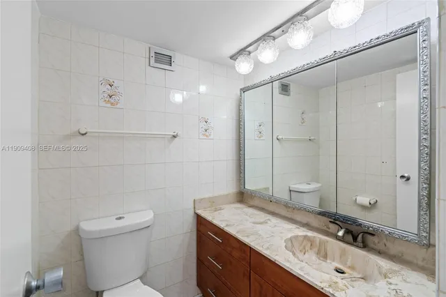 a view of a tall building from the balcony